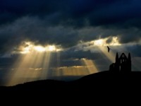 How to Stay Happy on a Rainy Day Sun peaking through storm clouds